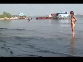 Very attractive naked young teenager fishing on public